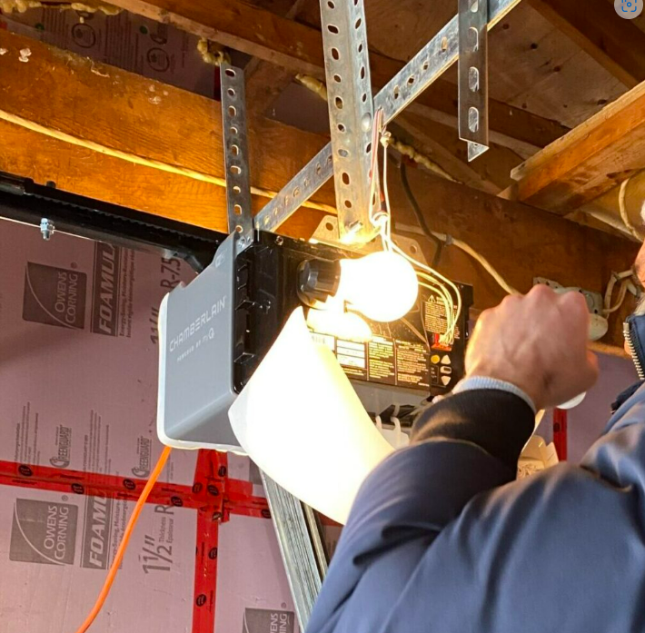 Technician performing garage door opener repair in Nokomis, FL, ensuring smooth operation and safety for homeowners.