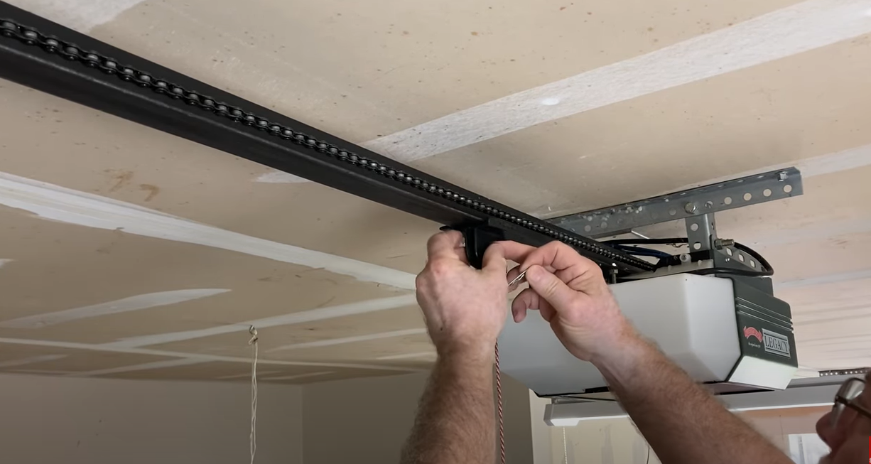 Technician performing garage door opener repair in Nokomis FL"